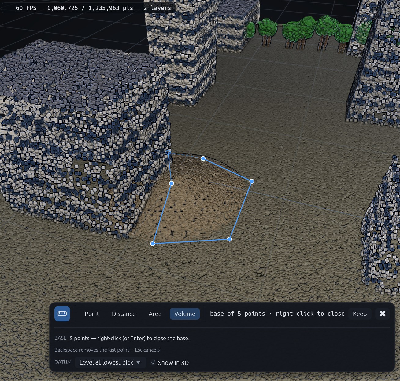 Tracing the base of a stockpile for a volume measurement: points clicked around its foot, with the prompt to right-click to close the base